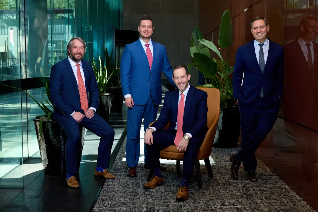Chopin Law Firm attorneys posed in office seating area